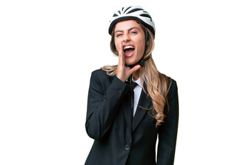 Business Uruguayan woman wearing a helmet biker over isolated background shouting with mouth wide open