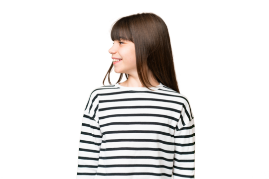 Little caucasian girl over isolated background looking side