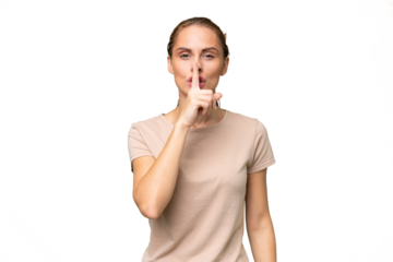 Young caucasian woman over isolated background showing a sign of silence gesture putting finger in mouth