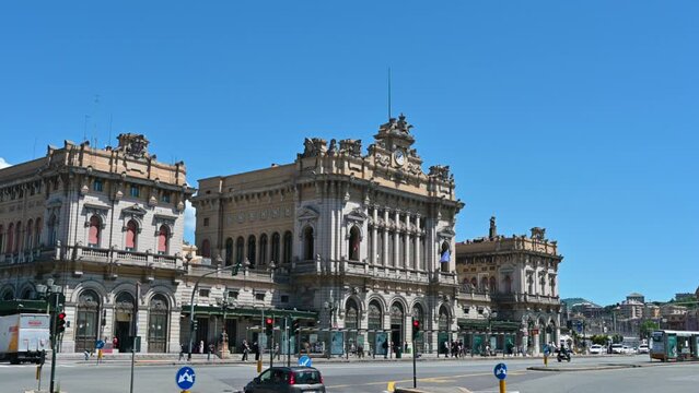 Genoa, Liguria, Italy 18 May 2024. The imposing fa&ccedil;ade of the Genoa Brignole station, the fascinating romantic architecture of the French school strikes the observer. Car passing. Tilt.