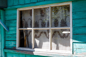Wooden window frame of a farmhouse in the village