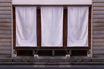 The curtain-like fabric that hangs in front of traditional Japanese restaurants and shops not only serves as a signboard, but holds a larger meaning,