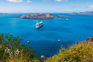 Santorini island, Greece. Cruise ship near the coast.