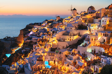 Night lights in Santorini island, Greece. White architecture with sea view in Oia town.