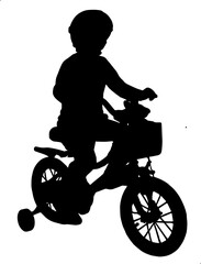 silhouette of a child riding a bike