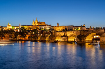 Charles bridge (Karlův most) and Hradcany castle hill over Vltava in the night, Prague, Czech Republic