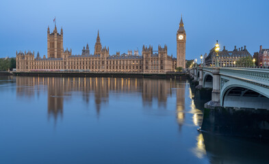 Early morning with Palace of Westminster and Big Ben clock tower seen across River Thames, London, United Kingdom