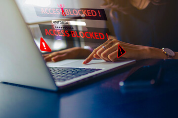 System warning alert on smartphone. Cyber attack on laptop network, Virus, Spyware, Malware or Malicious software. Cyber security and cybercrime.