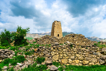 the stone ruins of the tower of the old city in the mountains of the North Caucasus. Russia