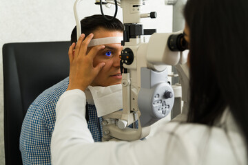 Man receiving a thorough eye examination from a skilled ophthalmologist using advanced technology...