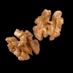 Walnuts isolated on black background