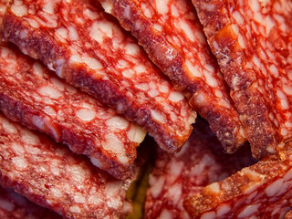 Cured Meat Detail. A detailed view of marbled salami slices, suitable for culinary advertising.