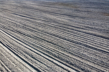 Plowed agricultural field, aerial view. Agricultural land. Background.