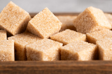 Cubes of cane sugar in closeup.