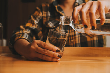 healthy beautiful young woman holding glass of water