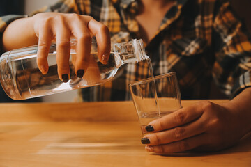 healthy beautiful young woman holding glass of water