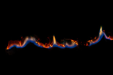 burning paper, glowing edge of paper on a black background.