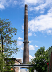 brick chimney of a factory against the sky