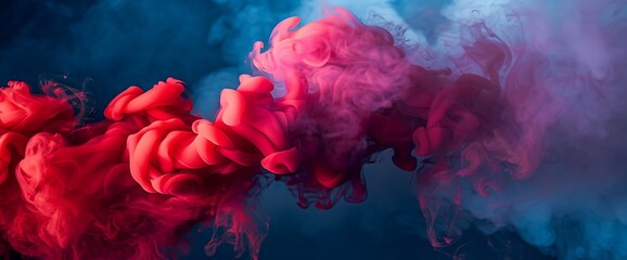 Fototapeta premium Layers of vibrant red smoke billowing against a backdrop of deep blue, creating a dynamic contrast of light and shadow.