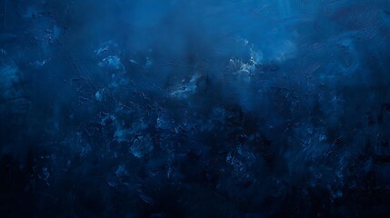 Obraz premium Intriguing contrasts and textures emerge from the depths of a dark blue canvas, in a minimalist composition bathed in soft light.