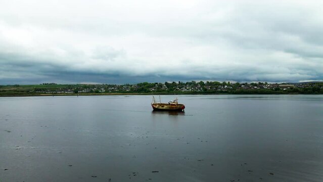 Wide drone shot of the shipwreck in the Foyle River, Derry, Northern Ireland