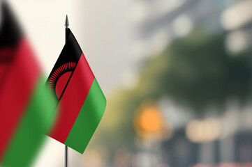 Small flags of Malawi on a blurred background