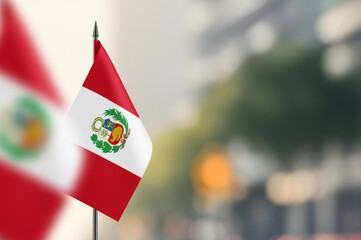 Small flags of Peru on a blurred background