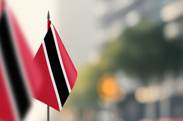 Small flags of Trinidad and Tobago on a blurred background