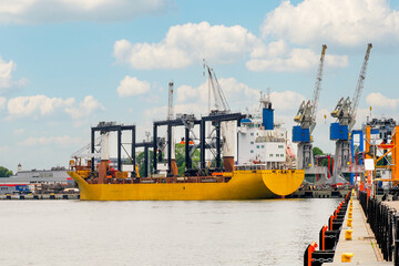 Port of Gdansk, Poland, Baltic Sea, on the right Ship called HAPPY DIAMOND, cranes are loading
