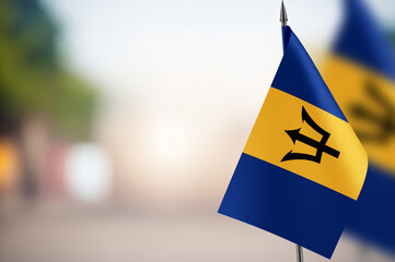 Small flags of Barbados on a blurred background