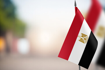 Small flags of Egypt on a blurred background