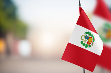 Small flags of Peru on a blurred background