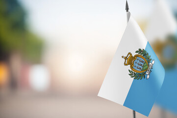 Small flags of San Marino on a blurred background