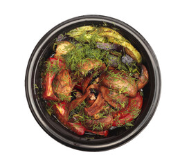 Grill roast vegetable in black plate on white isolated. Zucchini, tomato, pepper, mushrooms.