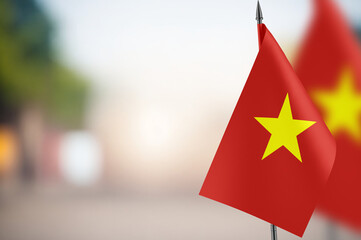 Small flags of Vietnam on a blurred background