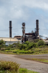 Wireless mobility cell site, antennas mounted to smokestack towers at an abandoned sugar mill, Maui, Hawaii
