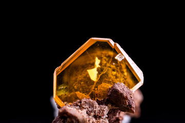 yellow, orange wulfenite. From USA. On black background.