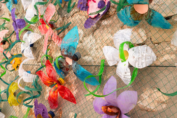 Fototapeta premium Flower wall decoration with plastic bottles made from plastic waste. Concept: Waste recycling and environmental protection