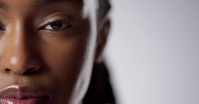 Eye, beauty and face of half black woman in studio for cosmetics, skincare or lashes on white background. Closeup, sight and portrait of model for eyecare, grooming or contact lens with mockup