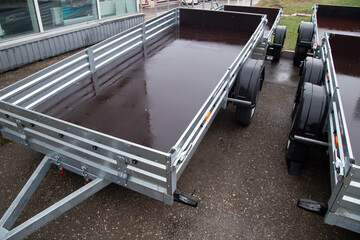 Obraz premium Open road trailer. Shop selling car trailers.