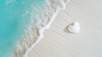  heart seashell in the white sand with the turquoise sea and soft waves in background - travel concept