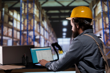 Warehouse employee doing quality control on products, preparing merchandise for shipment and...