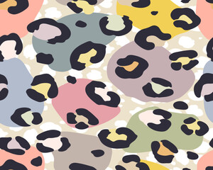 Seamless pattern of fashionable exotic pattern with leopard skin and spots of different colors. Creative artistic collage
