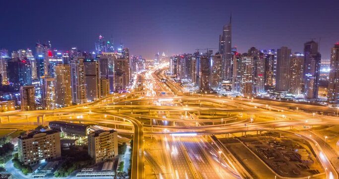 Aerial Flight Over Urban Highway At Night Rush Hour Traffic Metropolitan City Skyline Dubai Business District Low Light Uhd Hdr 4k