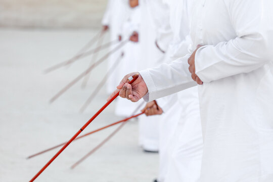 Traditional Emirati Al Ayalah male dance, UAE heritage, hands in frame