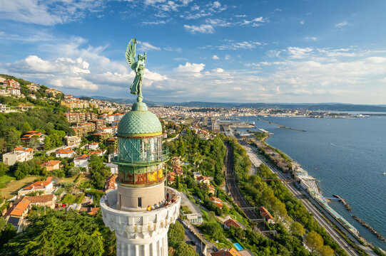 Faro della Vittoria lighthouse in Trieste city at sunny day, Italy