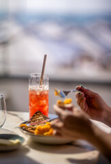 Women eat toast in morning sun