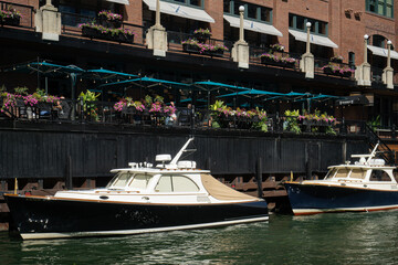 moored yachts in Chicago against the backdrop of a red brick loft building