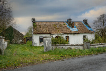 Delapidated and empty traditional Irish cottage