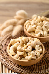 Raw cashew nuts in wooden bowl, Food ingredient